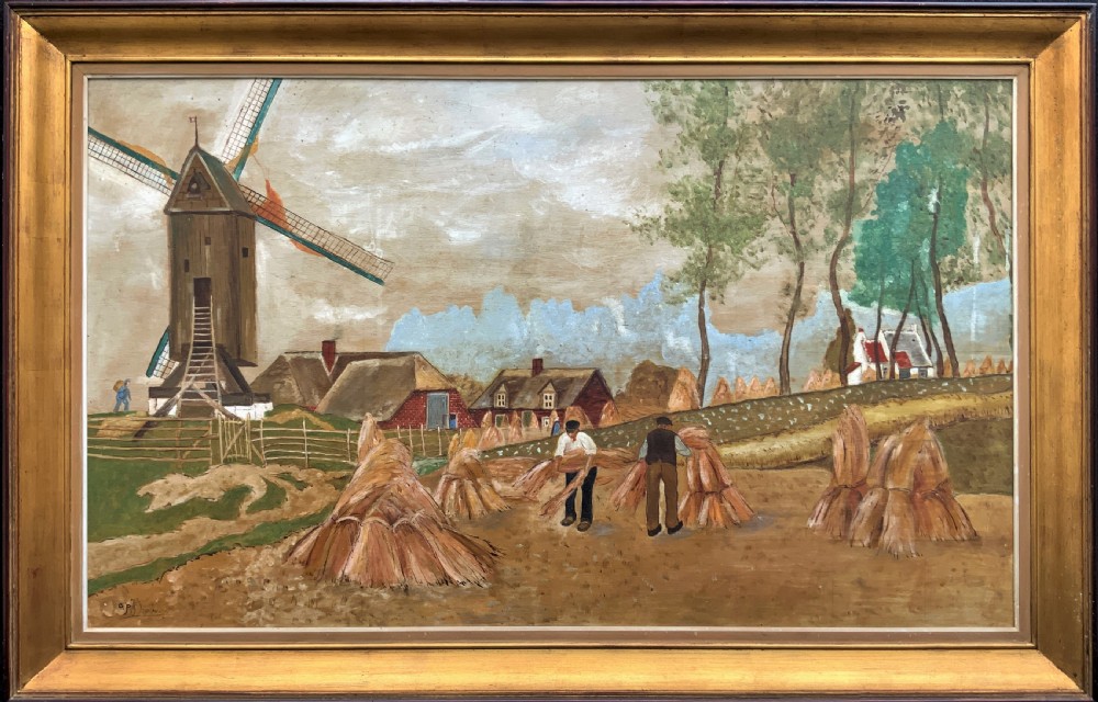 A mid-20th-century naive oil painting depicting agricultural workers gathering hay bales in a field beside a timber windmill, thatched cottages, and trees, presented in a gilt frame.
