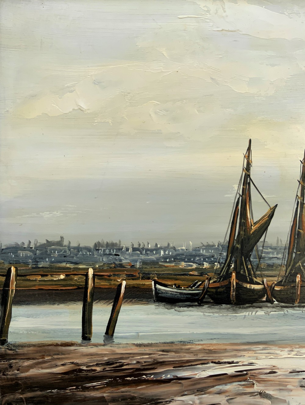 An impasto oil painting depicting two masted sailing barges moored on an estuary mudflat with an industrial skyline under a cloudy sky. View VIII