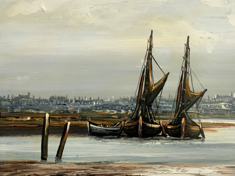 An impasto oil painting depicting two masted sailing barges moored on an estuary mudflat with an industrial skyline under a cloudy sky. View IX