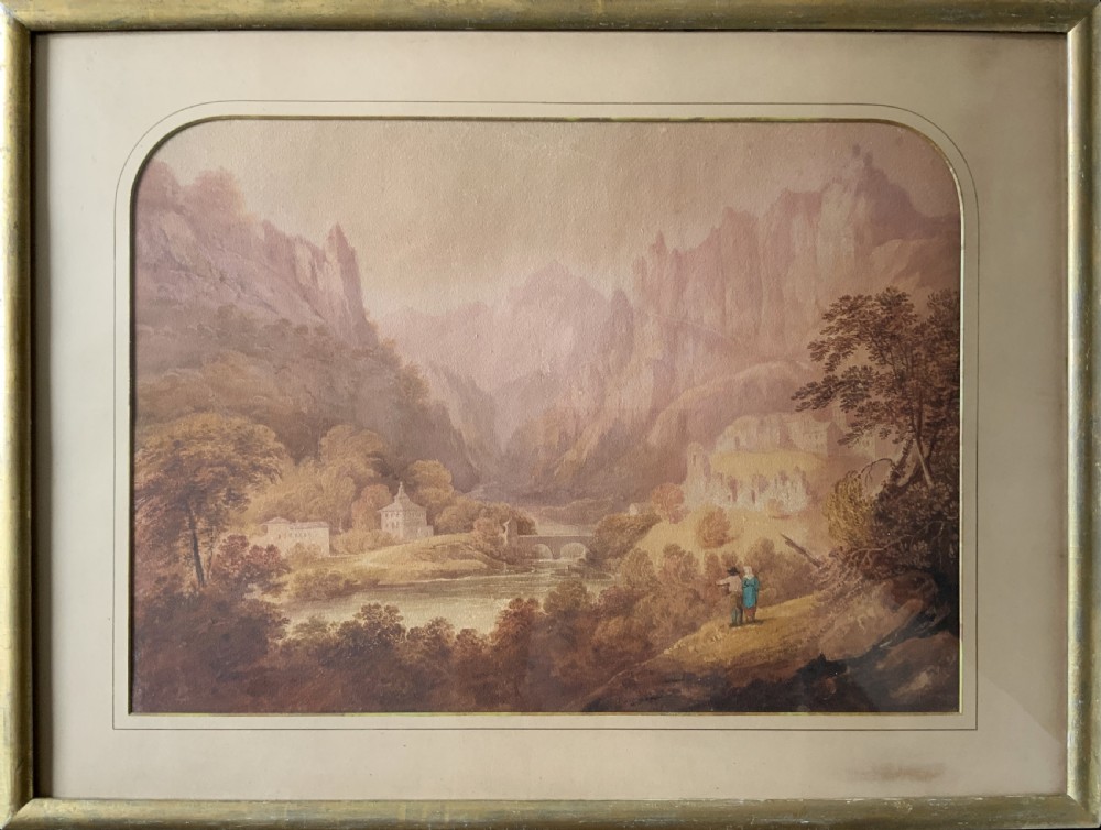 An antique 19th-century watercolour painting depicting a mountainous river landscape set within an arched cream mount and gilt wooden frame.