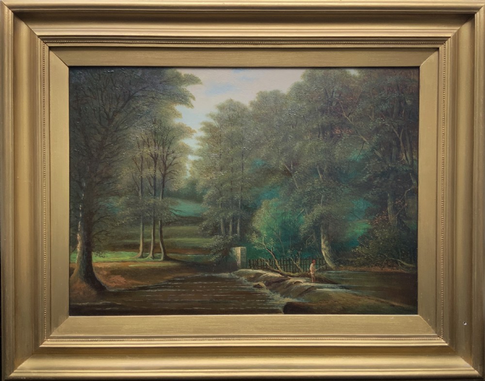An early 20th-century landscape oil painting displaying a woodland river scene with a figure fishing near a weir, encased in a deep gold frame.