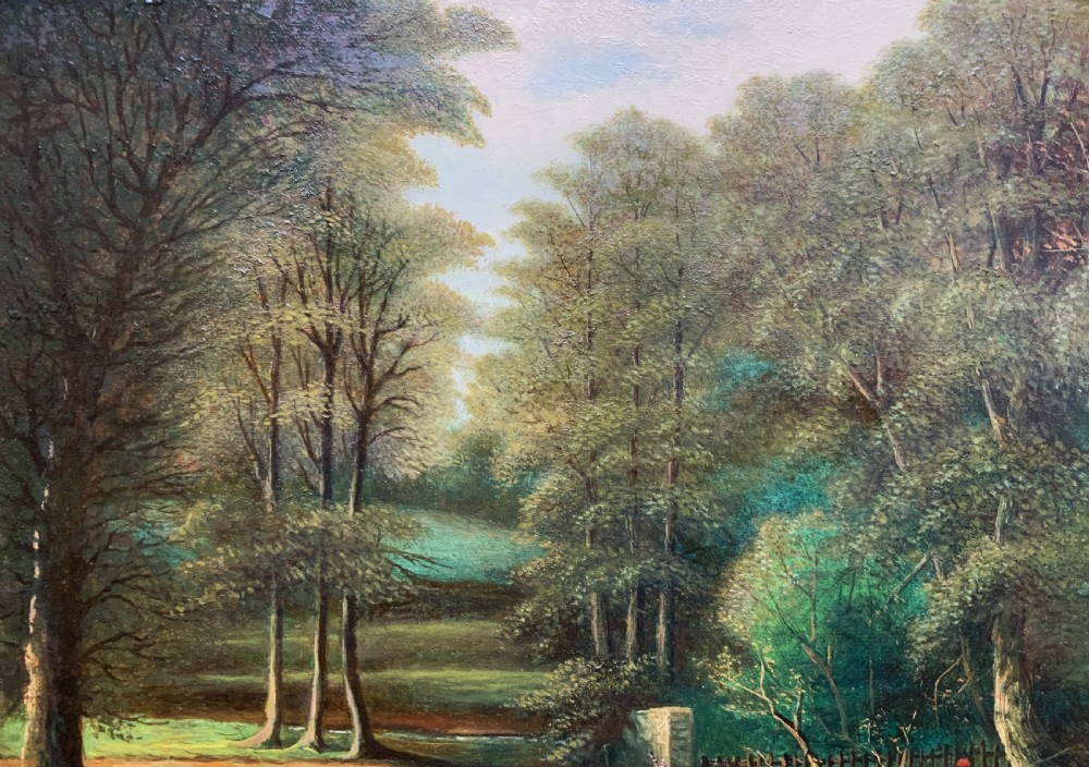 An early 20th-century landscape oil painting displaying a woodland river scene with a figure fishing near a weir, encased in a deep gold frame. View VII