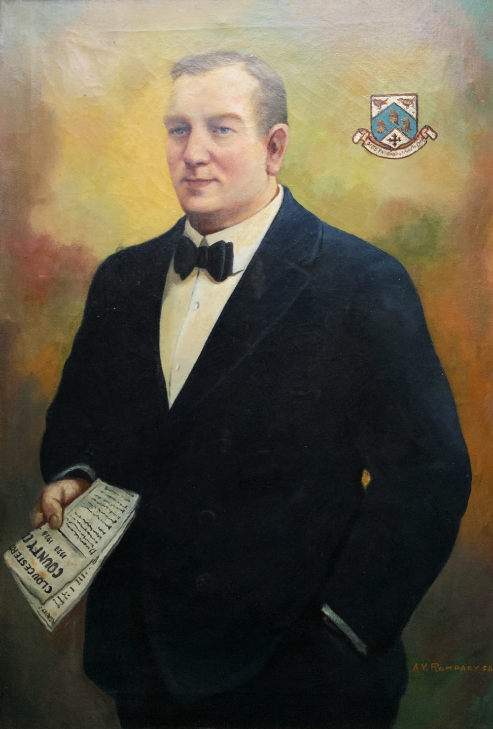 A framed oil portrait painting depicting a gentleman in a dark suit holding a paper document beside a small coat of arms. View II