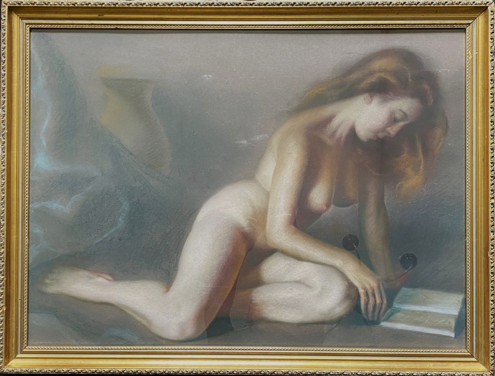 A framed mid-century pastel painting featuring a kneeling female nude reading an open book, rendered in soft neutral tones within a gilded wooden frame. View XI
