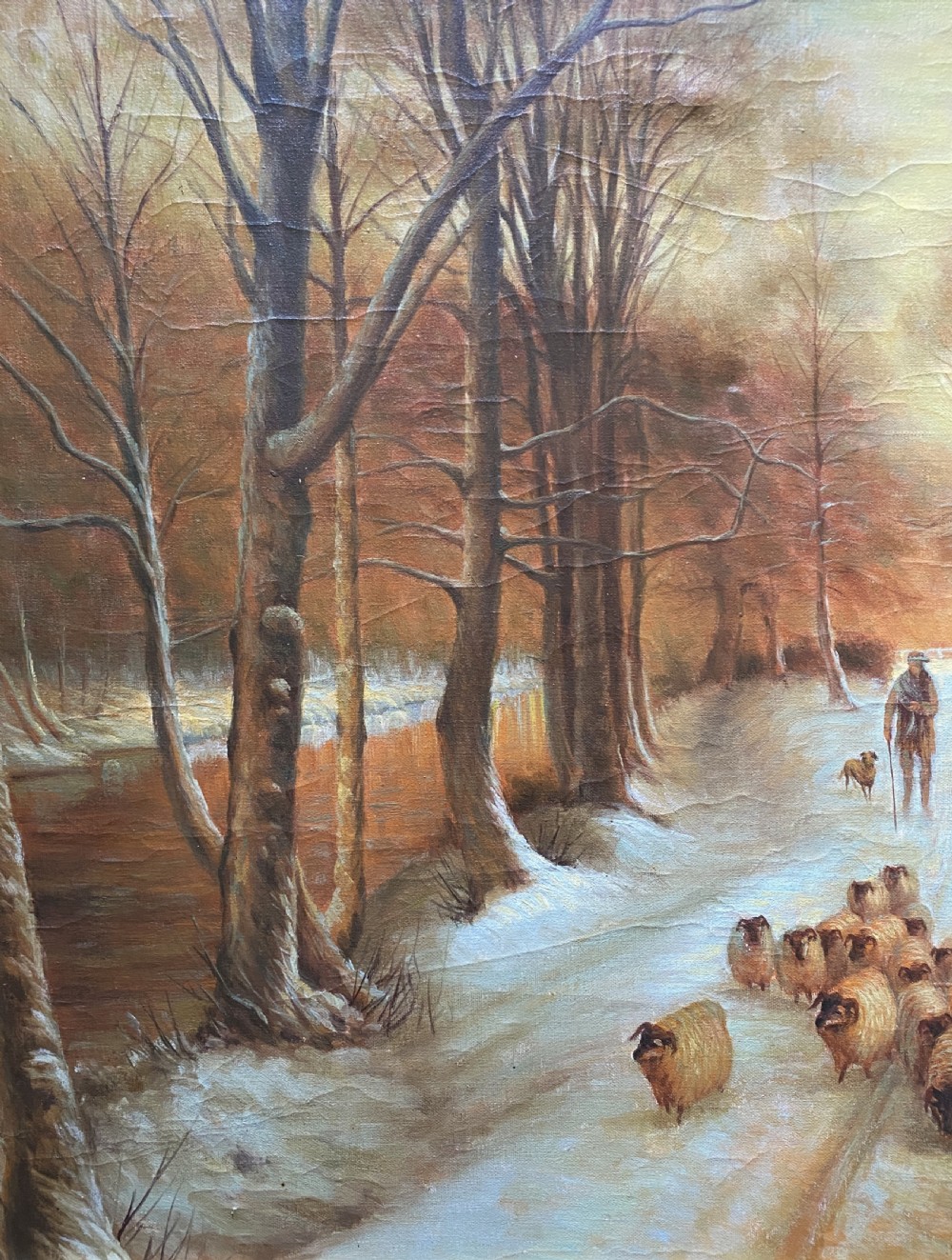 A framed oil painting depicting a shepherd droving a flock of sheep along a snow-covered forest track at sunset. View V