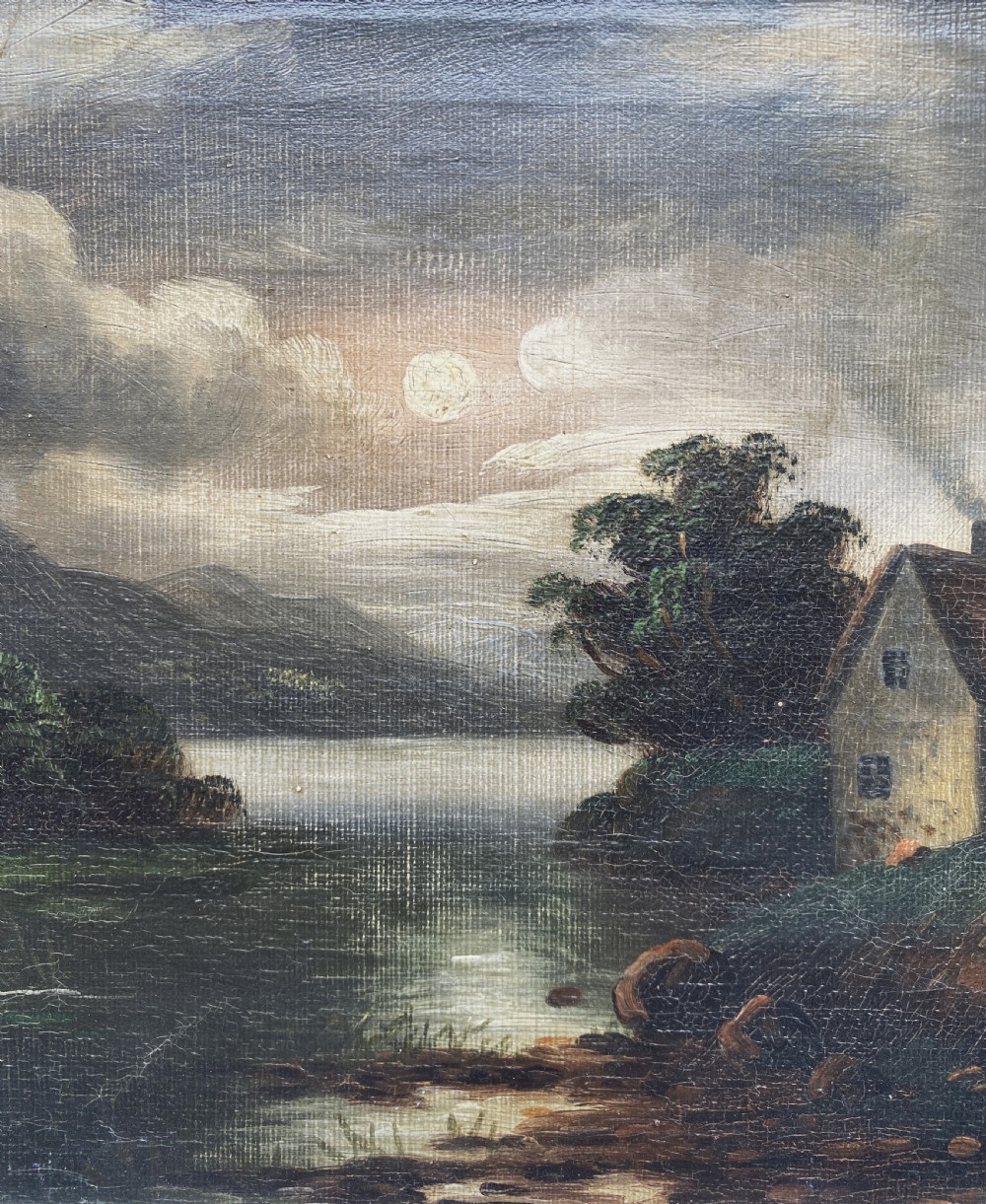 An oil painting depicting a moonlit highland loch scene with a small cottage near the water, framed in a thick white painted wooden frame. View V