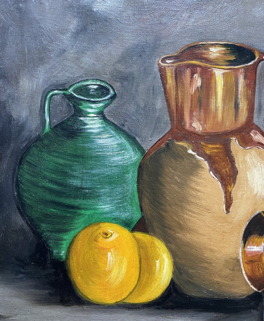 A framed mid-century oil painting depicting ceramic jugs, a metallic vessel, and yellow lemons set against a muted grey background. View VI