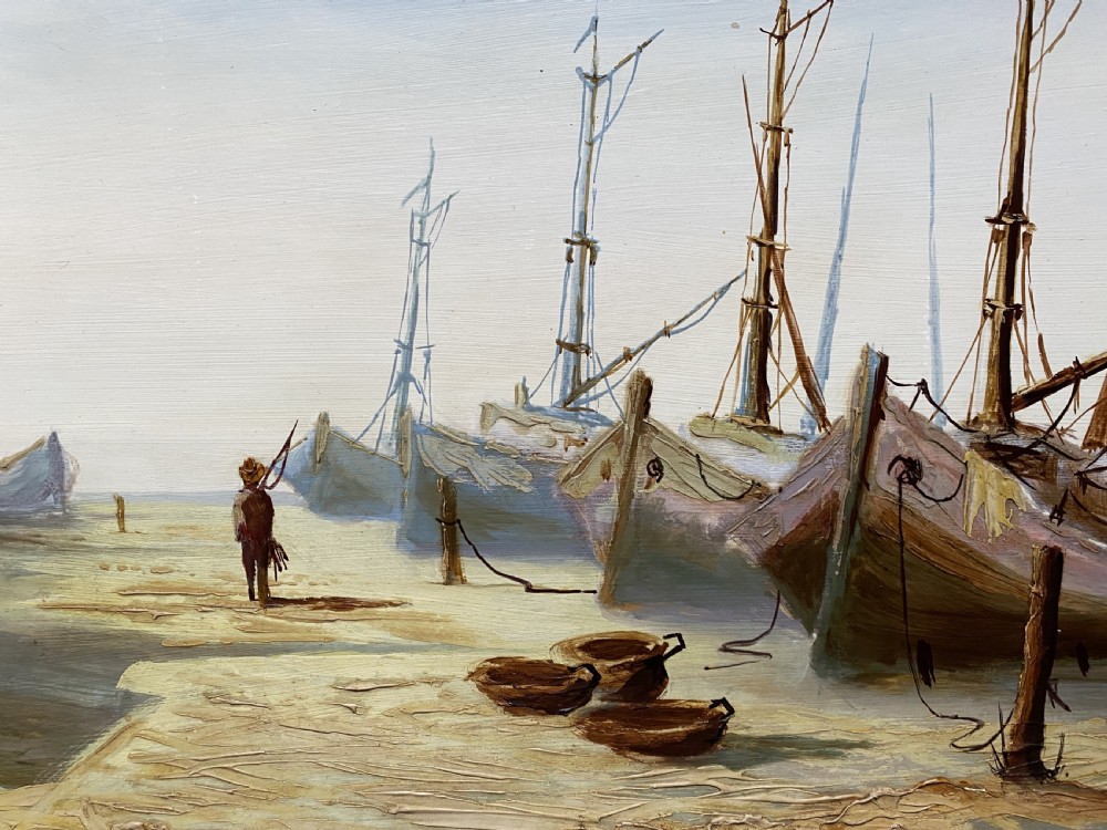 A horizontal mid-century oil painting depicting grounded fishing vessels on a sandy harbour floor beneath a cloudy blue sky, contained within a textured brown frame. View VIII