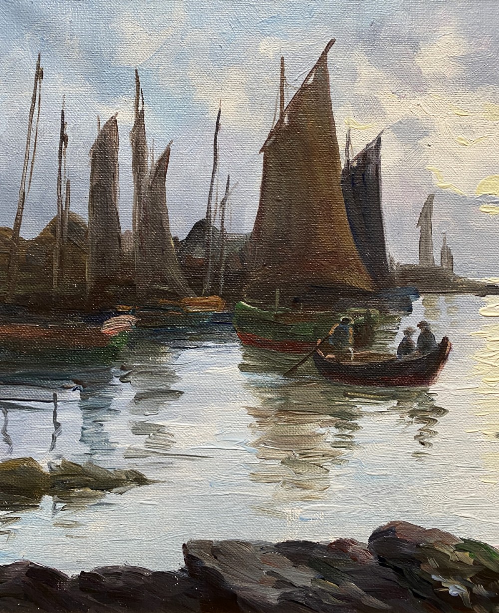 An impressionist oil painting depicting sailboats and figures in a calm harbour at sunset, enclosed within a textured gilt frame. View V