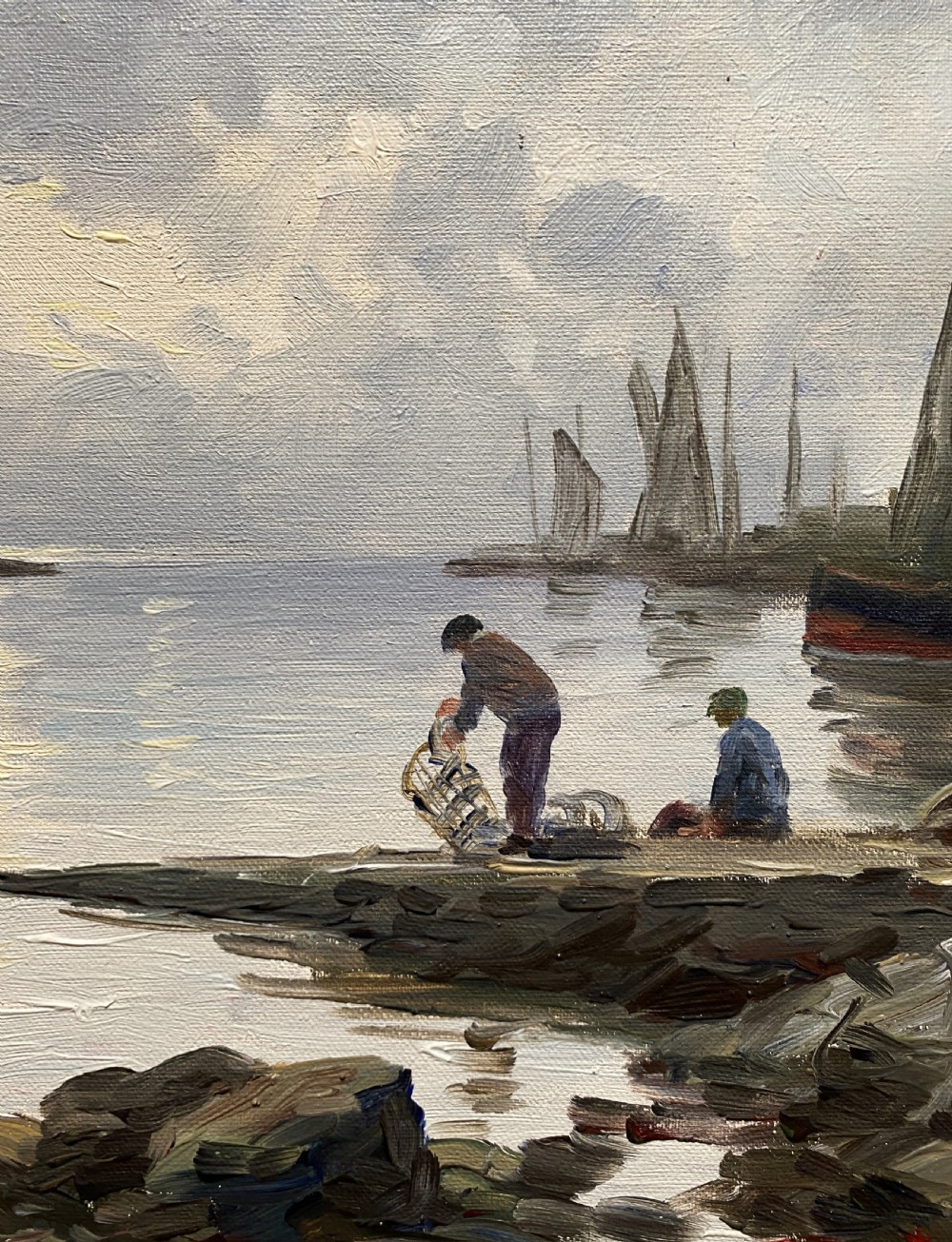 An impressionist oil painting depicting sailboats and figures in a calm harbour at sunset, enclosed within a textured gilt frame. View VII