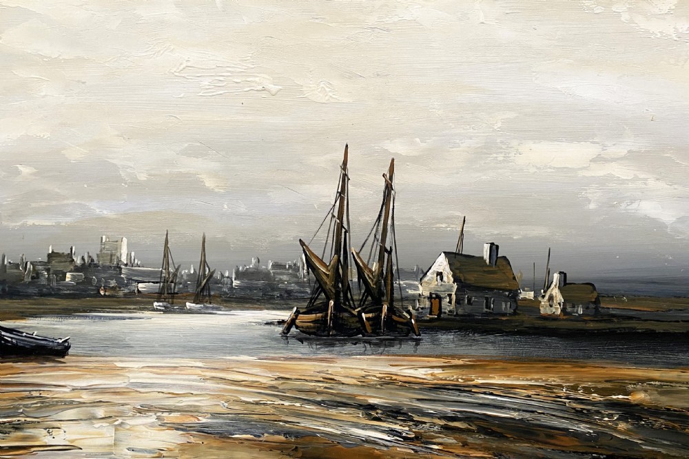 A framed impressionist maritime oil painting depicting boats anchored in a low-tide harbour under a cloudy sky, signed by Edward M. Elliott. View IV