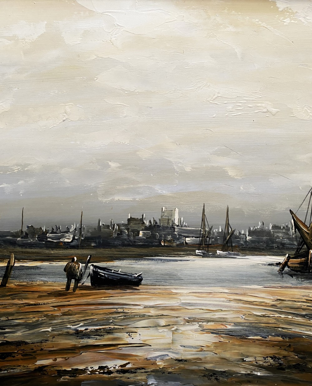 A framed impressionist maritime oil painting depicting boats anchored in a low-tide harbour under a cloudy sky, signed by Edward M. Elliott. View V