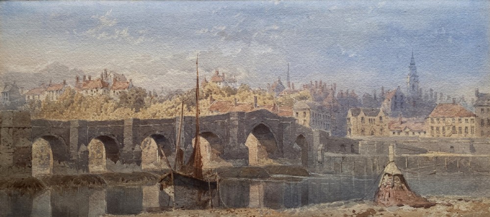 A framed 19th-century watercolour painting depicting a river and stone arch bridge in Hereford with a skyline, set within a gilded frame and cream mount. View II