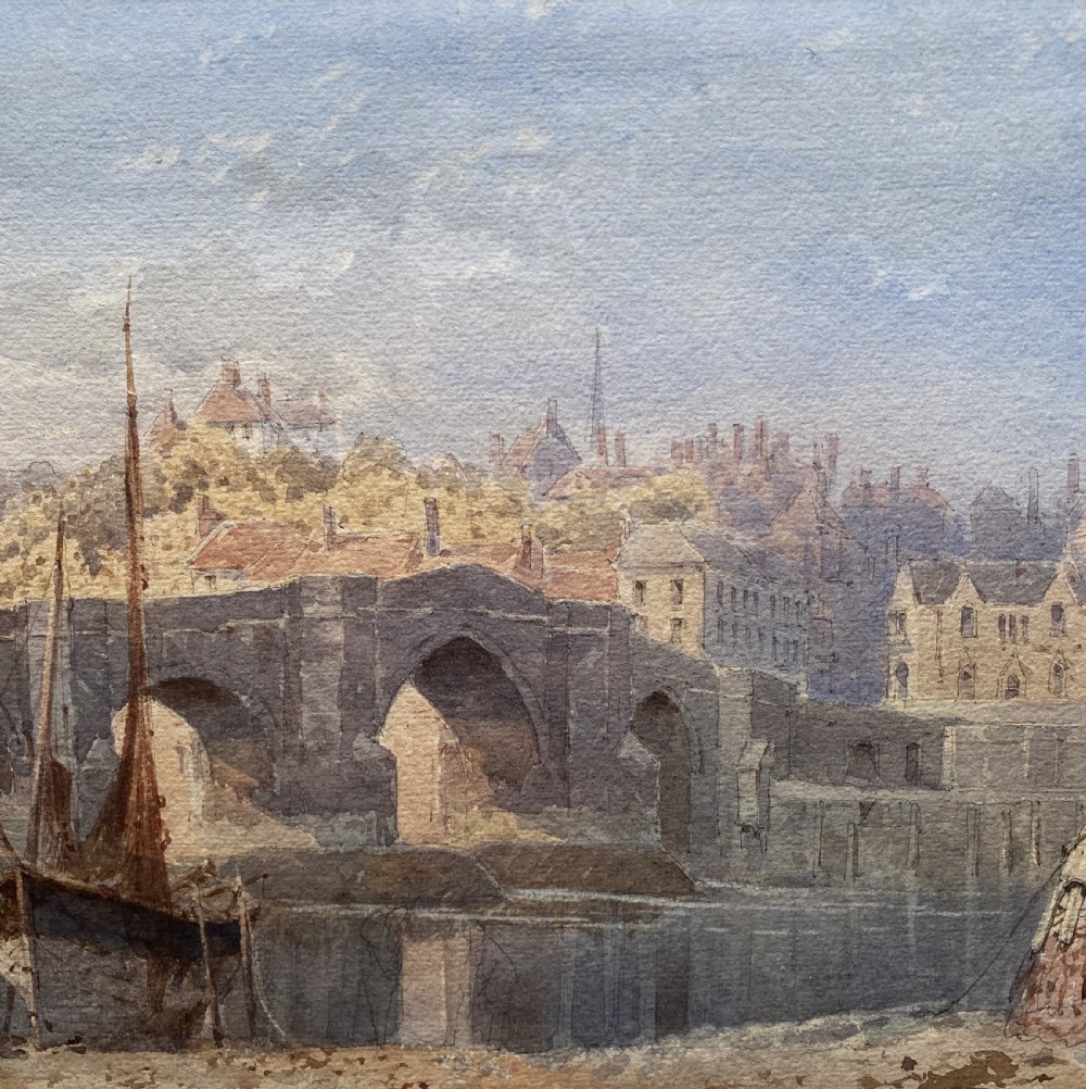 A framed 19th-century watercolour painting depicting a river and stone arch bridge in Hereford with a skyline, set within a gilded frame and cream mount. View V