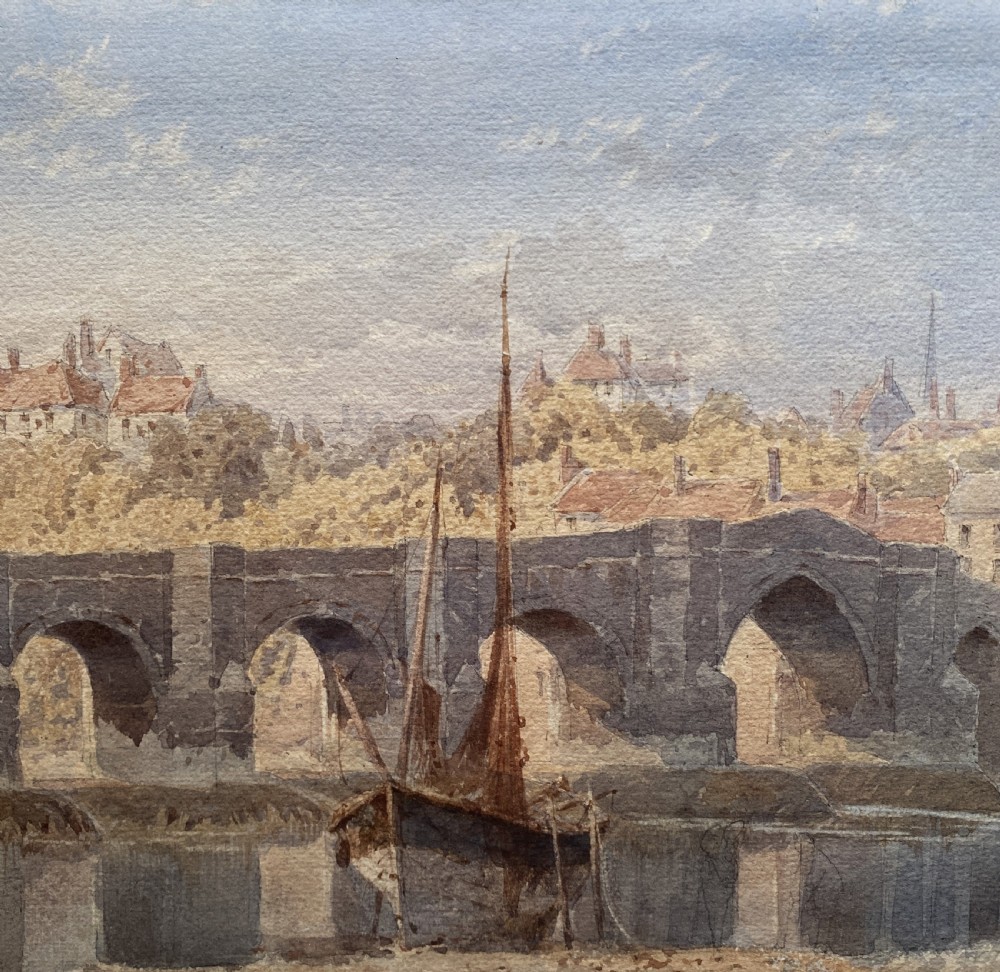 A framed 19th-century watercolour painting depicting a river and stone arch bridge in Hereford with a skyline, set within a gilded frame and cream mount. View VI