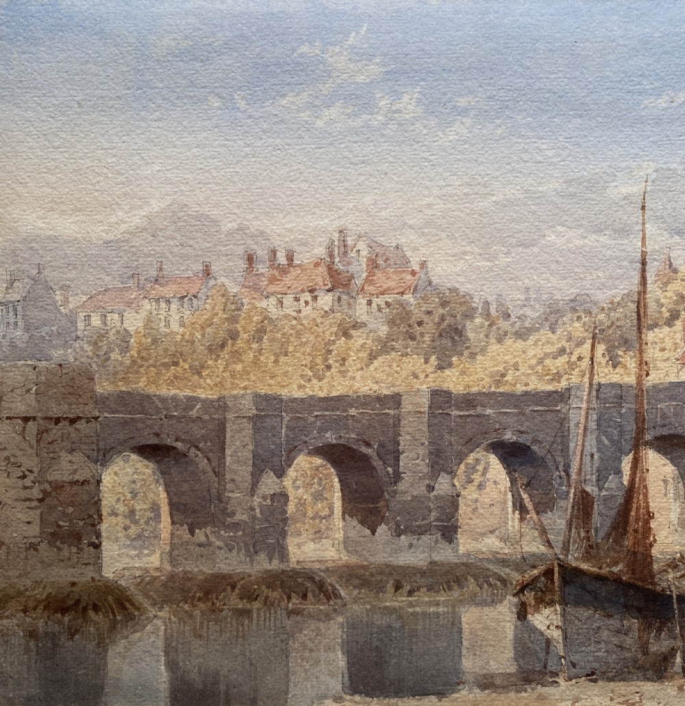 A framed 19th-century watercolour painting depicting a river and stone arch bridge in Hereford with a skyline, set within a gilded frame and cream mount. View VII