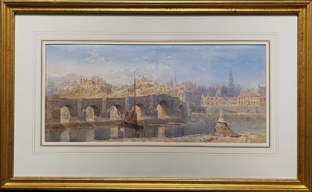 A framed 19th-century watercolour painting depicting a river and stone arch bridge in Hereford with a skyline, set within a gilded frame and cream mount. View XII