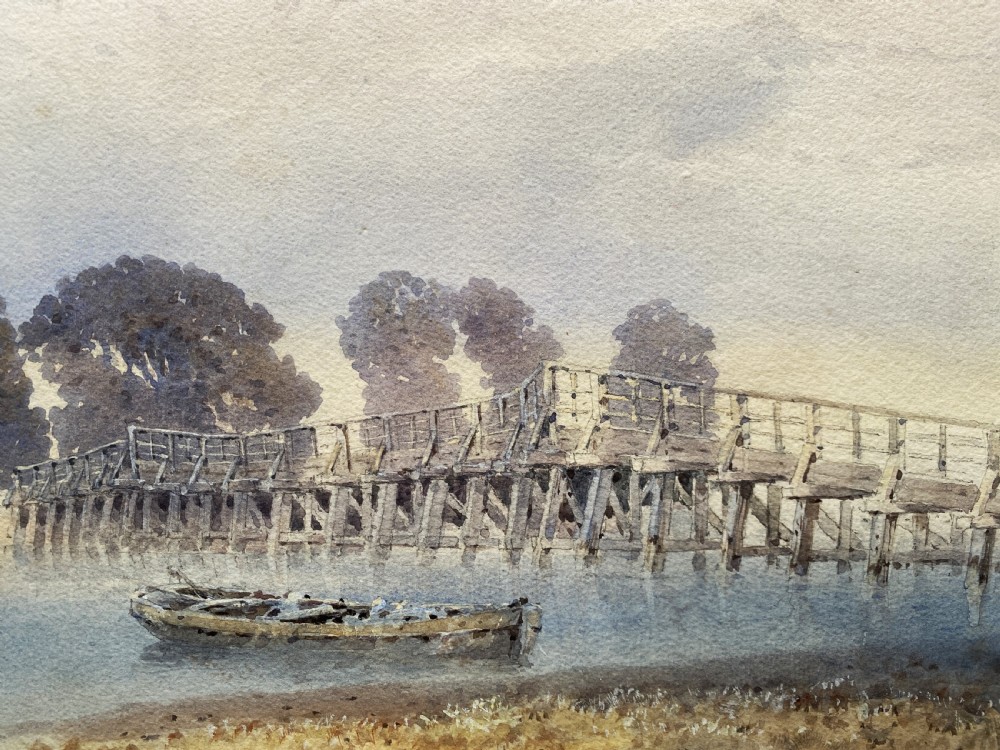 A framed watercolour painting depicting a wooden toll bridge across a river with a small boat and church in the background, set in a gilded frame. View VIII