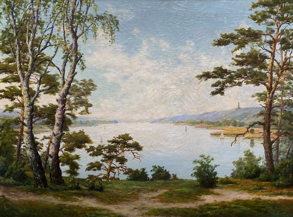 A signed 20th-century oil painting depicting a calm lake with sailboats framed by birch and pine trees in a silvered wooden frame. View II