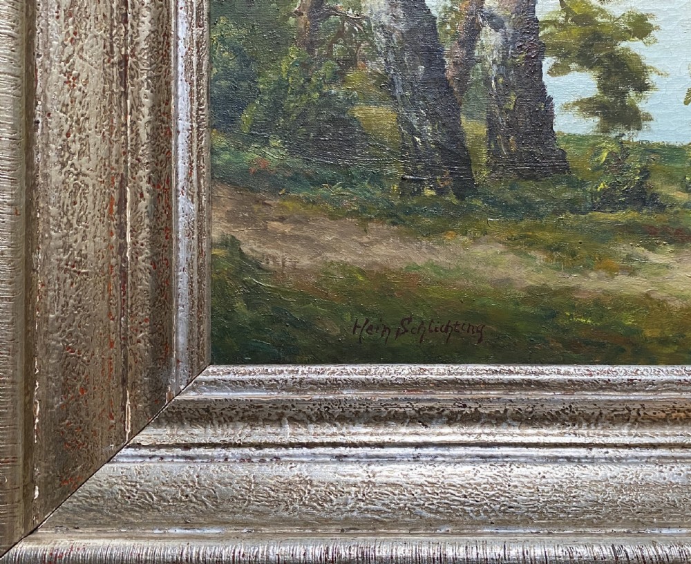 A signed 20th-century oil painting depicting a calm lake with sailboats framed by birch and pine trees in a silvered wooden frame. View X