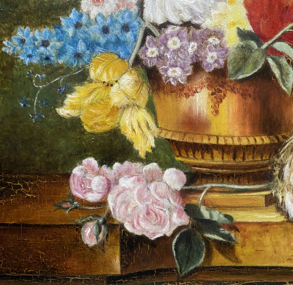 A framed oil painting featuring a floral bouquet in an urn set upon a ledge next to a bird nest. View X