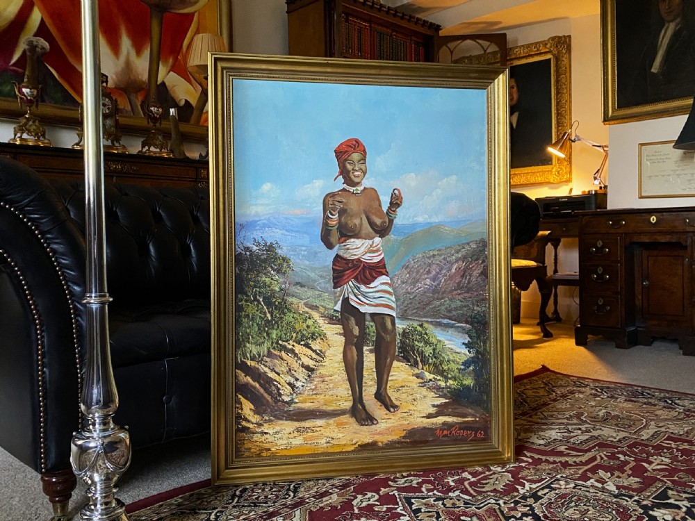 A mid-century impressionist oil painting depicting a smiling figure in traditional attire standing on a sunlit mountain path within a gold-painted frame. View XI