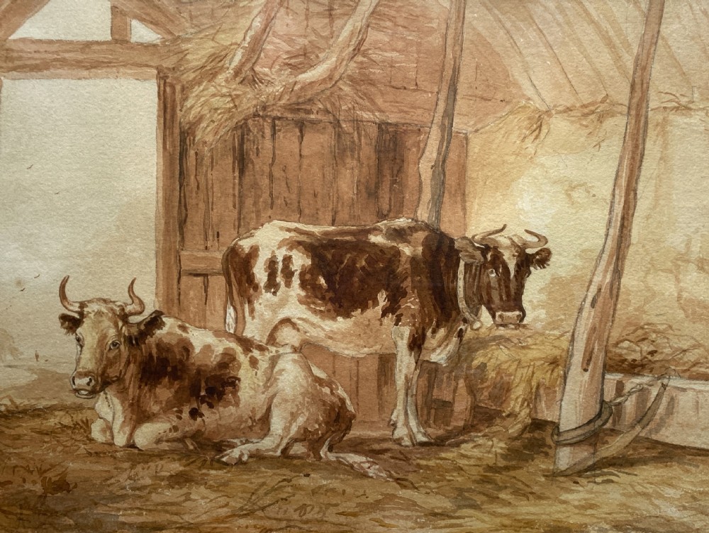 A sepia watercolour painting depicting two cows inside a timber barn, housed within a layered card mount and a burr wood frame. View III