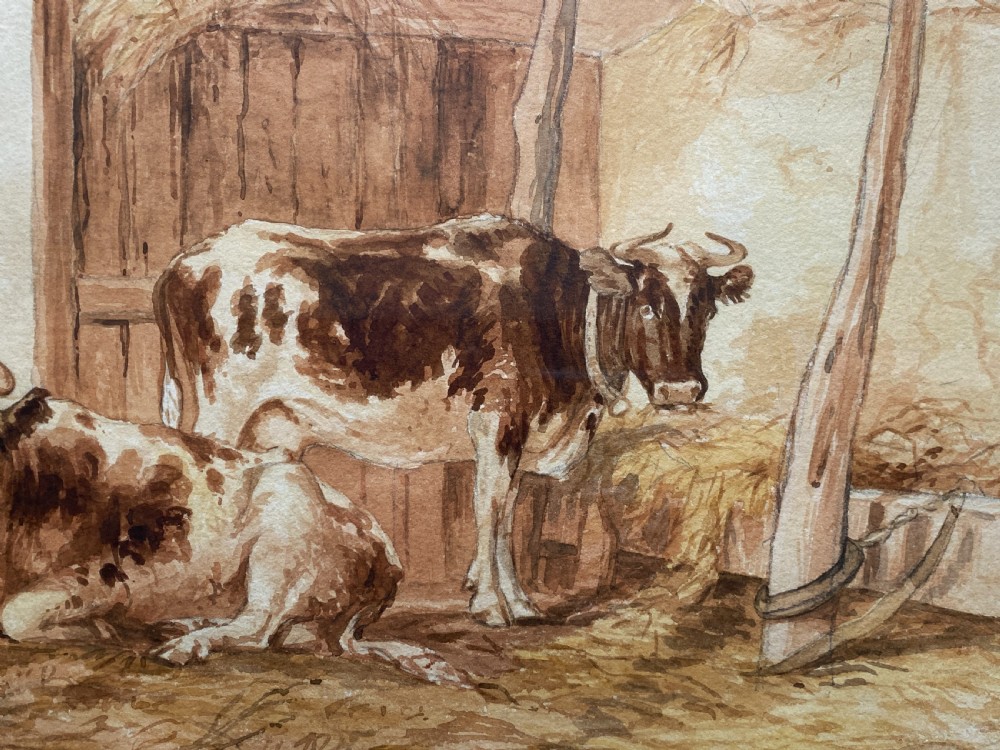 A sepia watercolour painting depicting two cows inside a timber barn, housed within a layered card mount and a burr wood frame. View VII