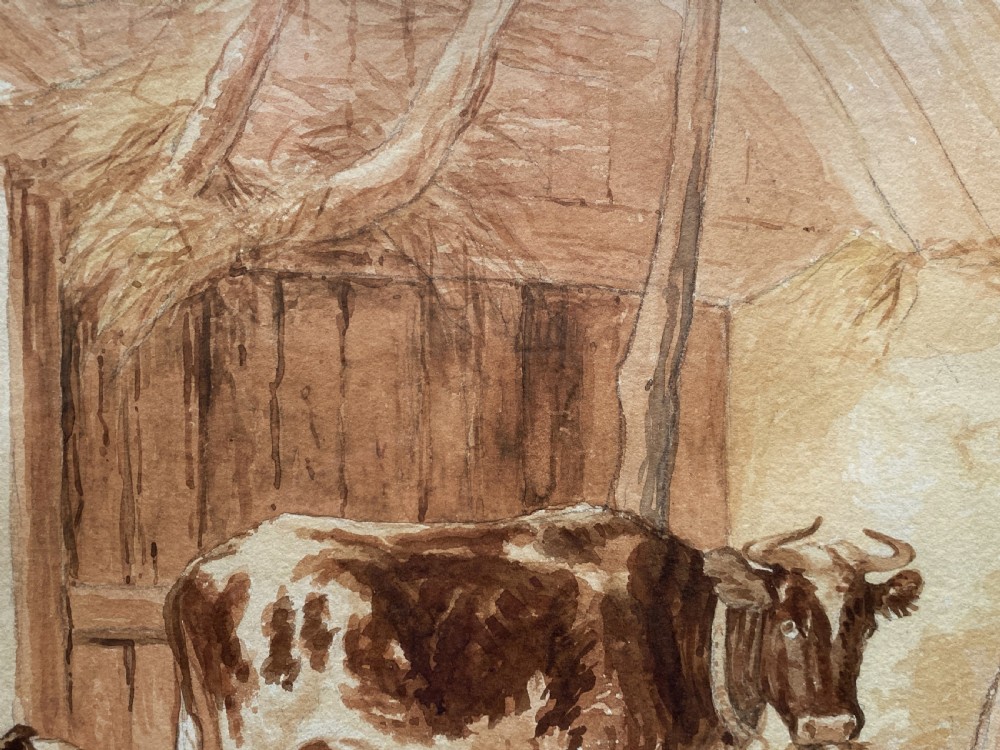 A sepia watercolour painting depicting two cows inside a timber barn, housed within a layered card mount and a burr wood frame. View X