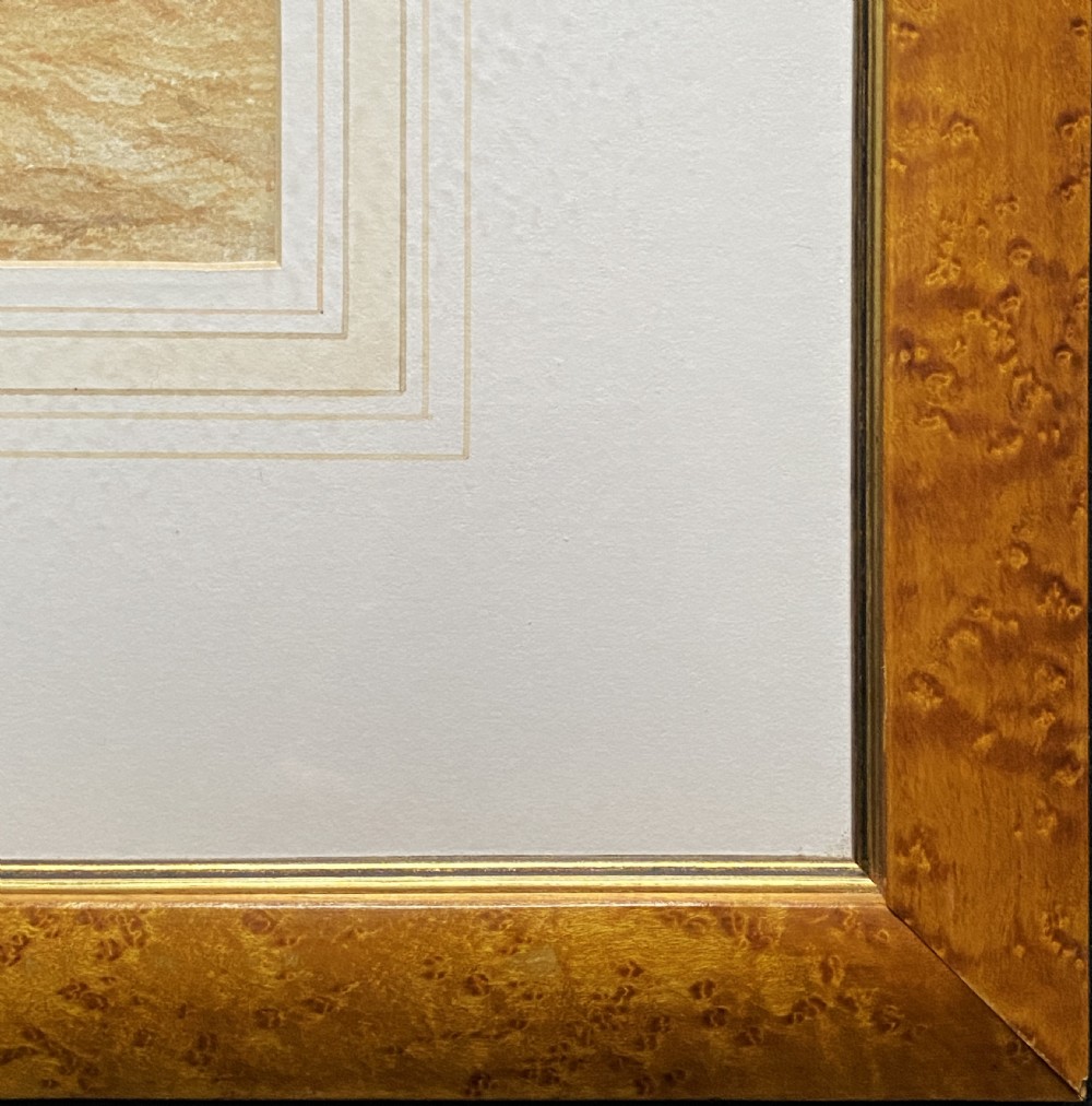 A sepia watercolour painting depicting two cows inside a timber barn, housed within a layered card mount and a burr wood frame. View XI