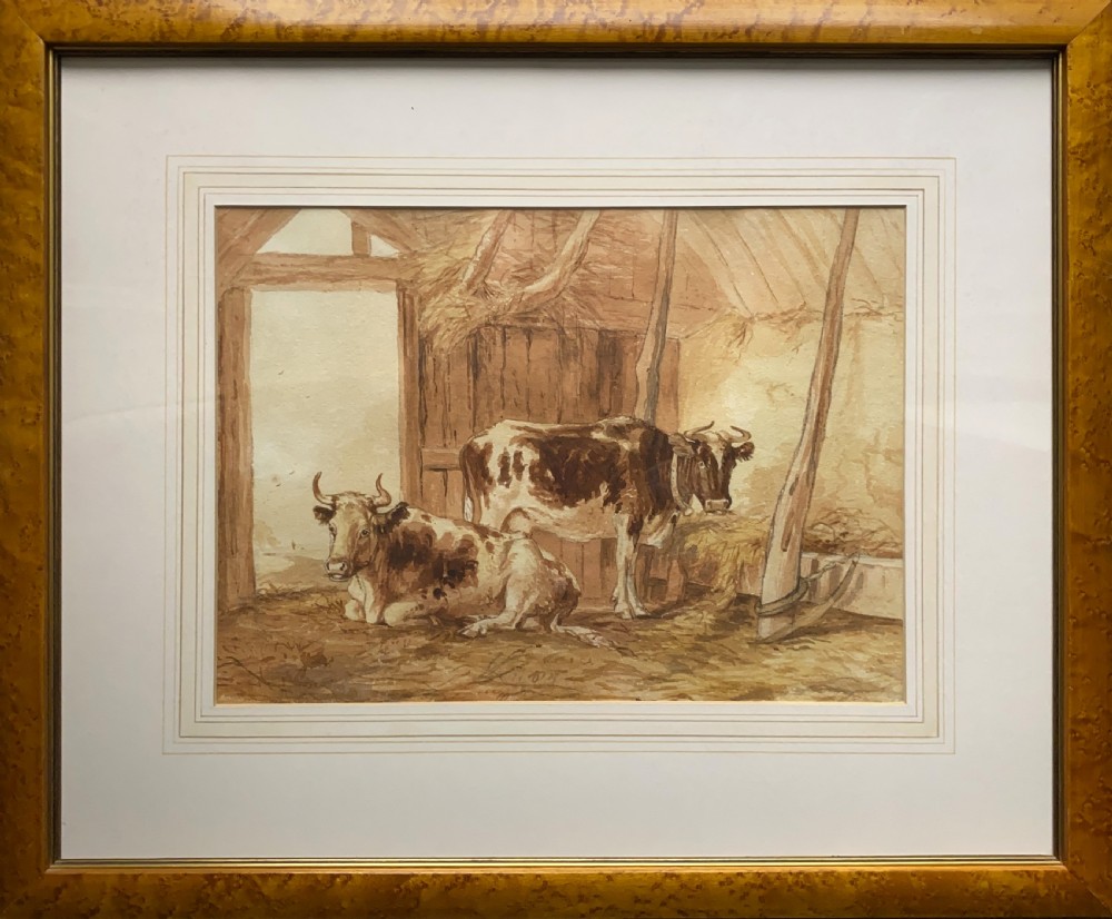 A sepia watercolour painting depicting two cows inside a timber barn, housed within a layered card mount and a burr wood frame. View XIII