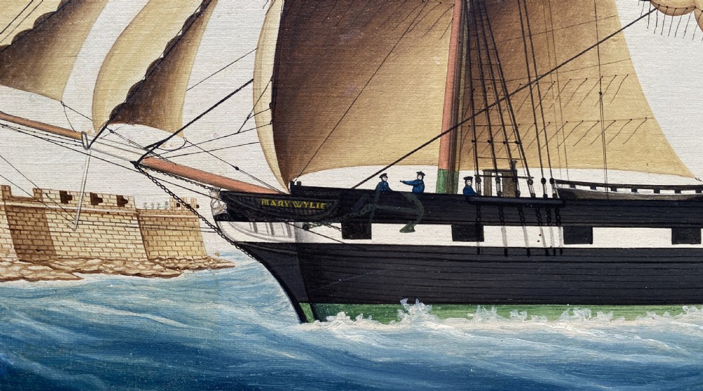 An early 19th-century marine oil painting depicting a two-masted brig ship sailing into Malta harbour, set within a black and gilt wooden frame. View X