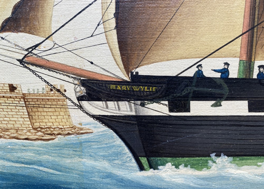 An early 19th-century marine oil painting depicting a two-masted brig ship sailing into Malta harbour, set within a black and gilt wooden frame. View XV