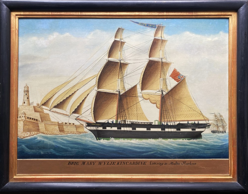 An early 19th-century marine oil painting depicting a two-masted brig ship sailing into Malta harbour, set within a black and gilt wooden frame. View XXI