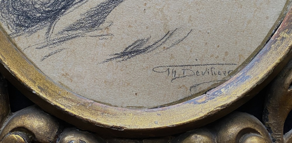 An oval charcoal profile drawing on paper depicting a bearded man with long hair, set inside a carved gold leaf Florentine frame. View VI