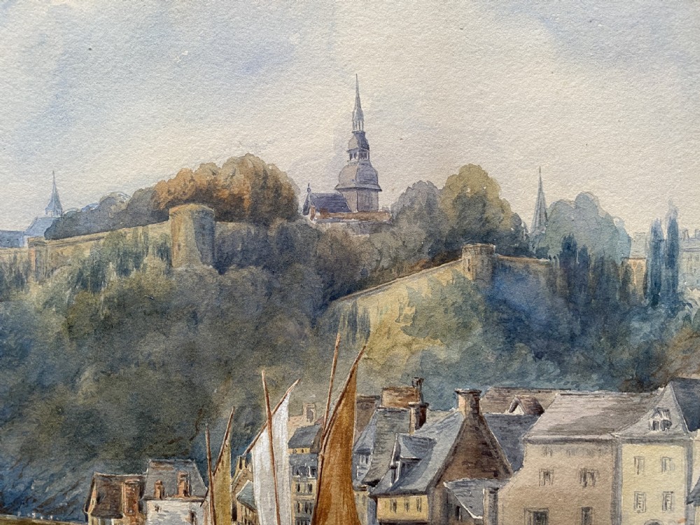 A framed 19th-century watercolour painting depicting a river scene with boats, a stone viaduct, and a hillside town set within an ornate gilded frame. View VIII