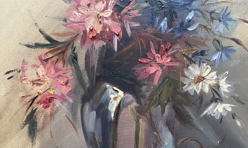 A mid-century oil painting on canvas depicting pink and blue flowers in a glass vase, displayed inside an ornate gold gilded frame. View VI