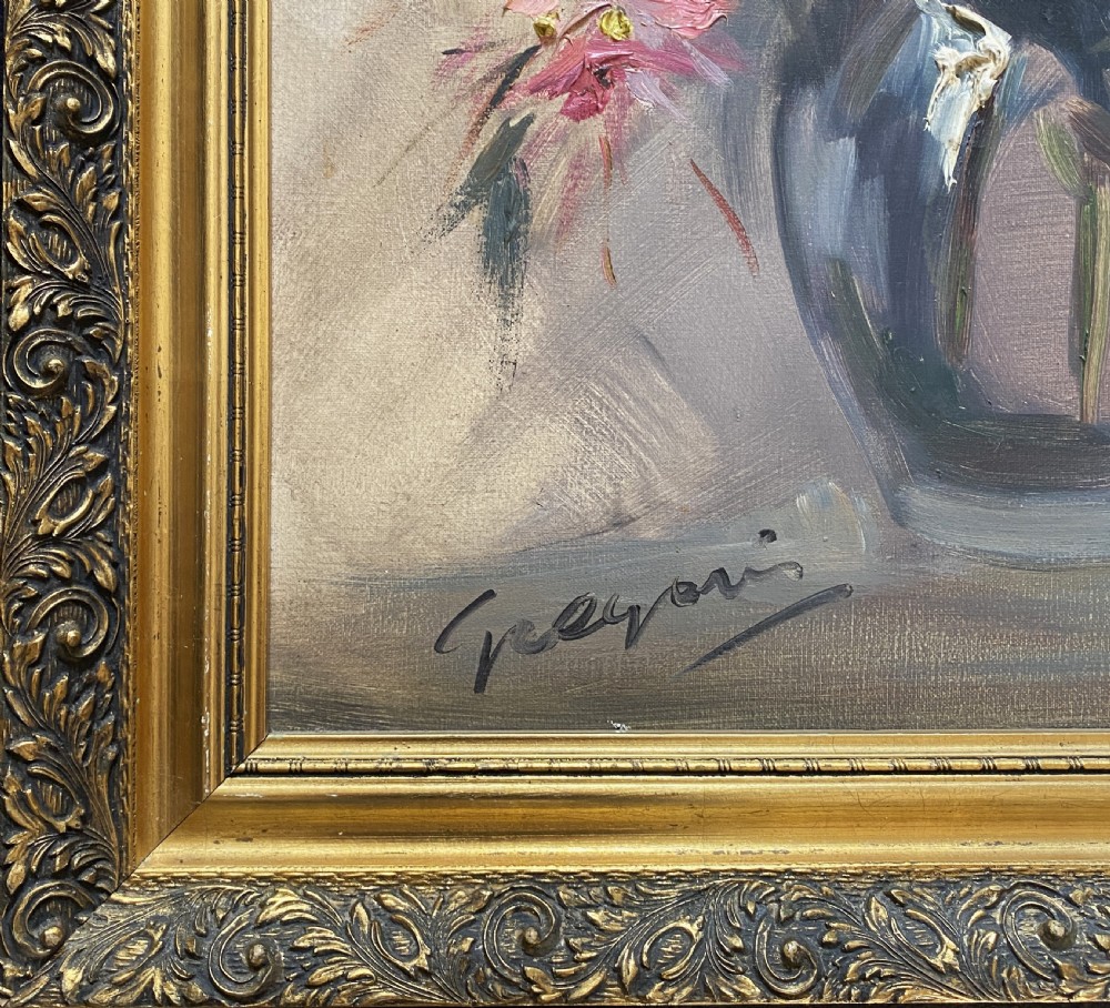 A mid-century oil painting on canvas depicting pink and blue flowers in a glass vase, displayed inside an ornate gold gilded frame. View X