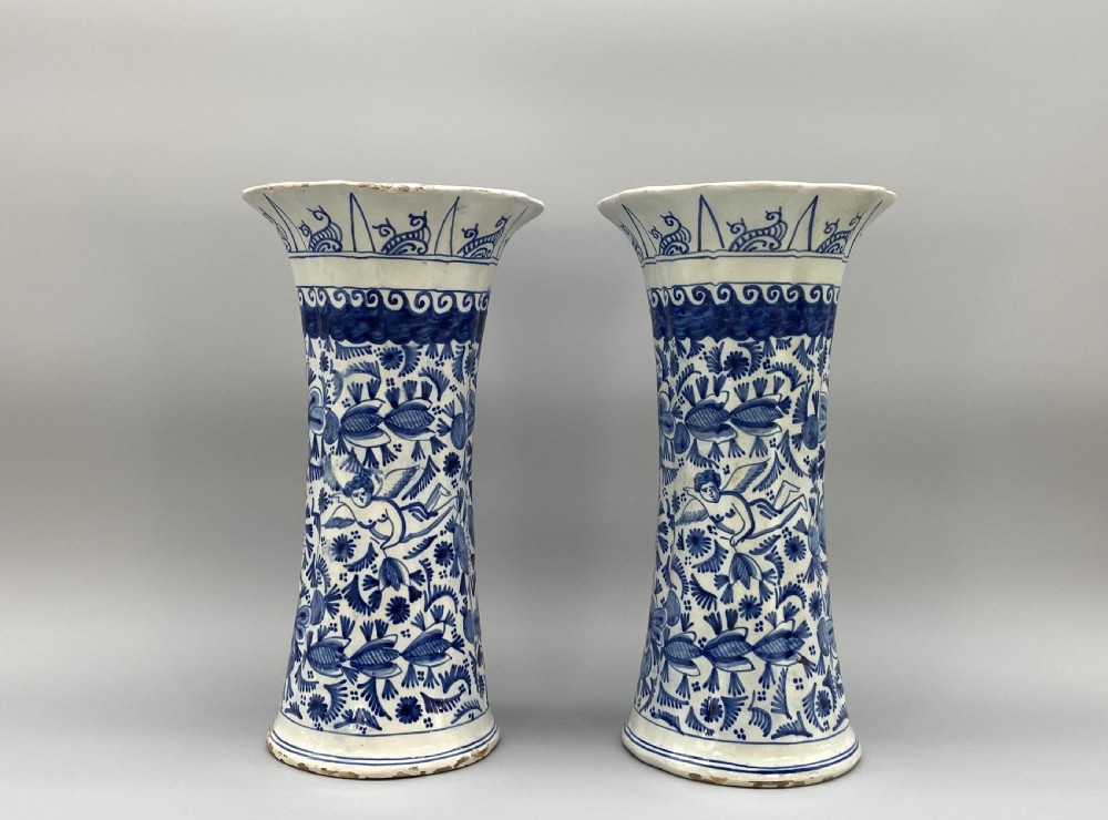 A pair of flared antique Dutch Delftware tin-glazed earthenware beaker vases decorated in cobalt blue and white with floral motifs and winged figures. View III