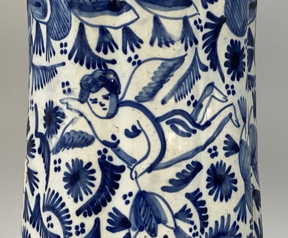A pair of flared antique Dutch Delftware tin-glazed earthenware beaker vases decorated in cobalt blue and white with floral motifs and winged figures. View XIII