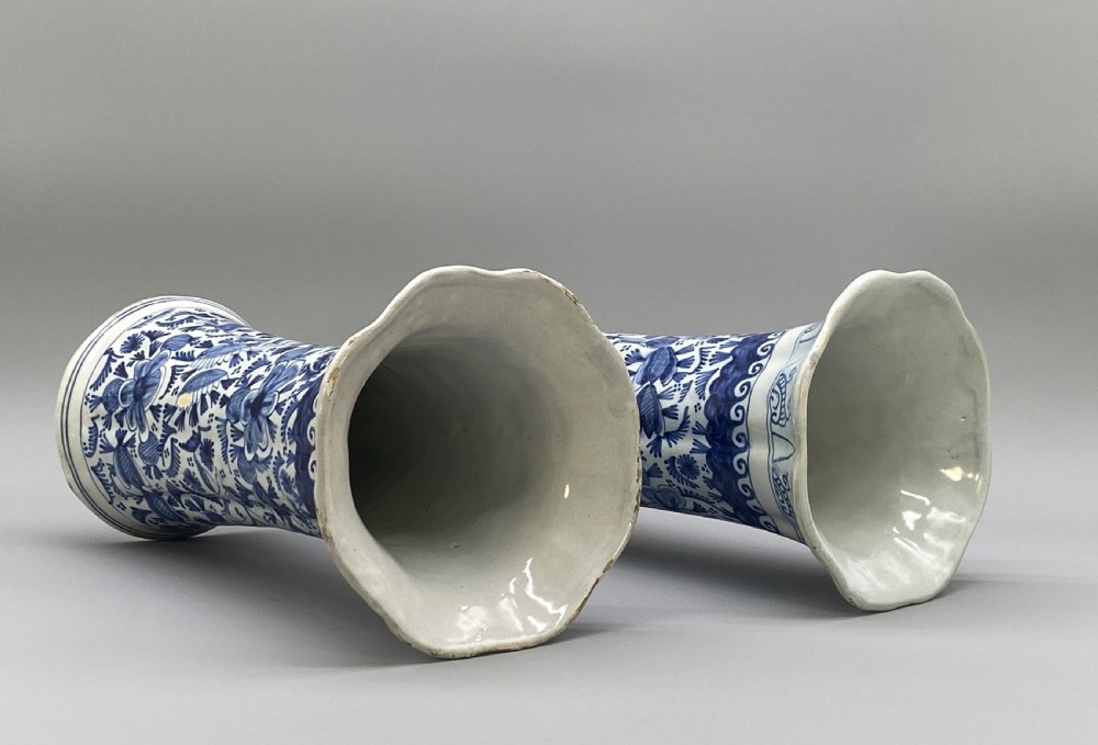 A pair of flared antique Dutch Delftware tin-glazed earthenware beaker vases decorated in cobalt blue and white with floral motifs and winged figures. View XIV