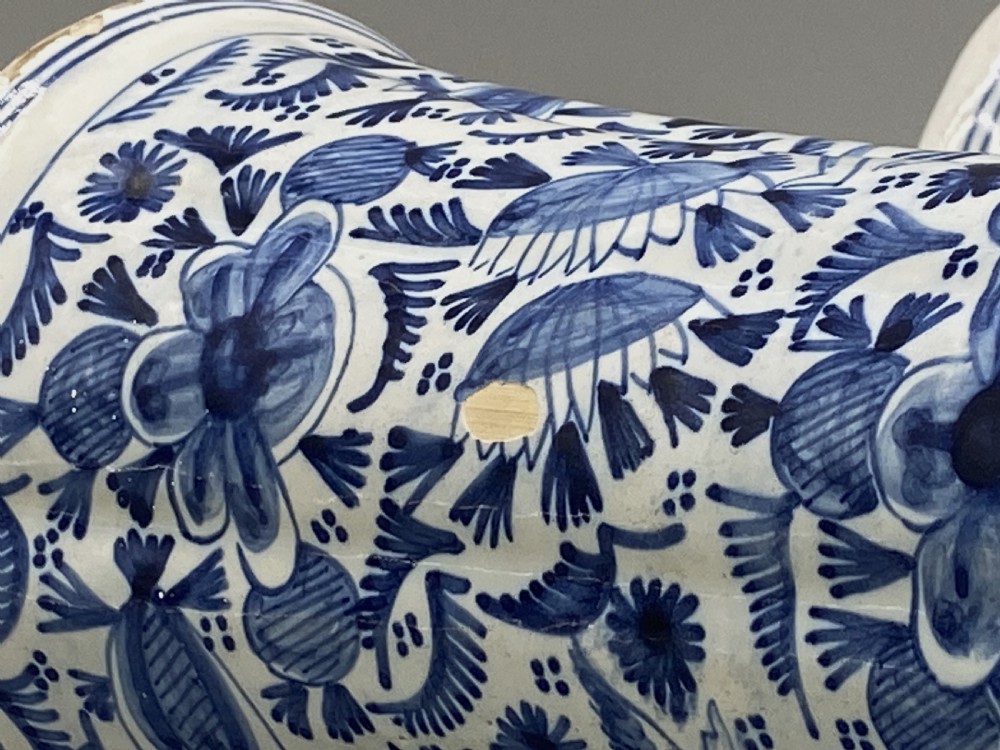 A pair of flared antique Dutch Delftware tin-glazed earthenware beaker vases decorated in cobalt blue and white with floral motifs and winged figures. View XV