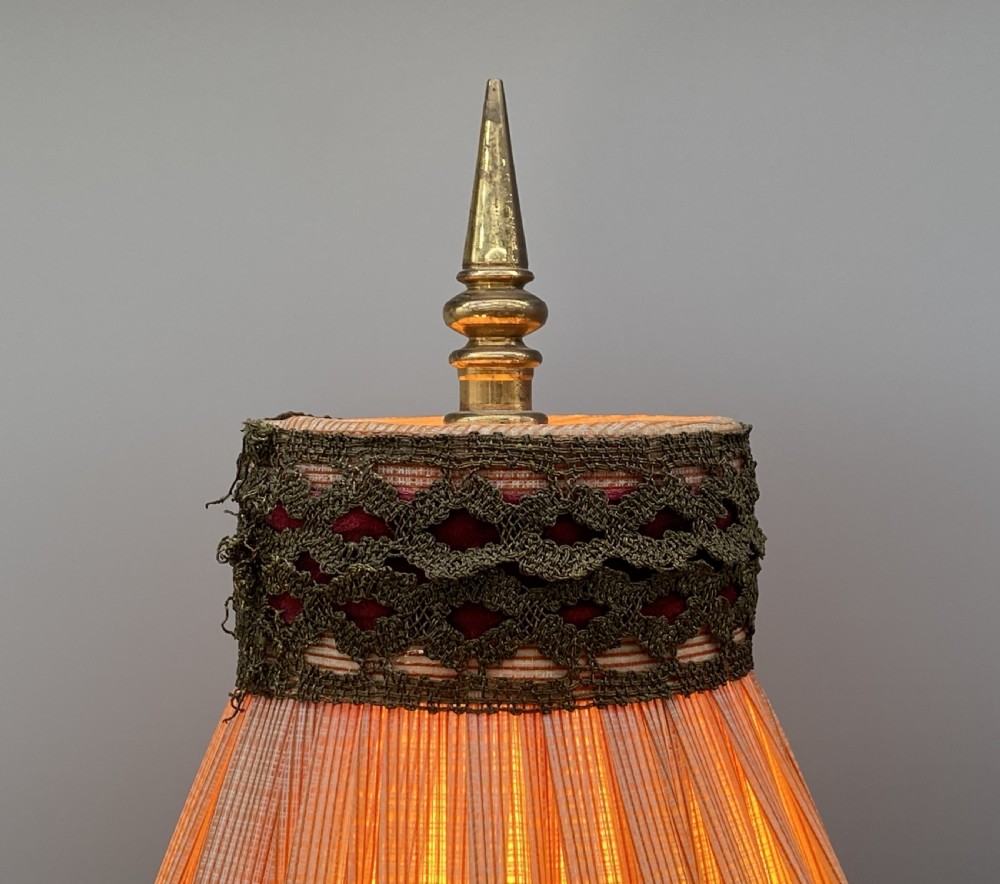 An antique French amphora-shaped white onyx table lamp with gilt metal handles and paw feet, topped with a pleated fabric shade. View VI