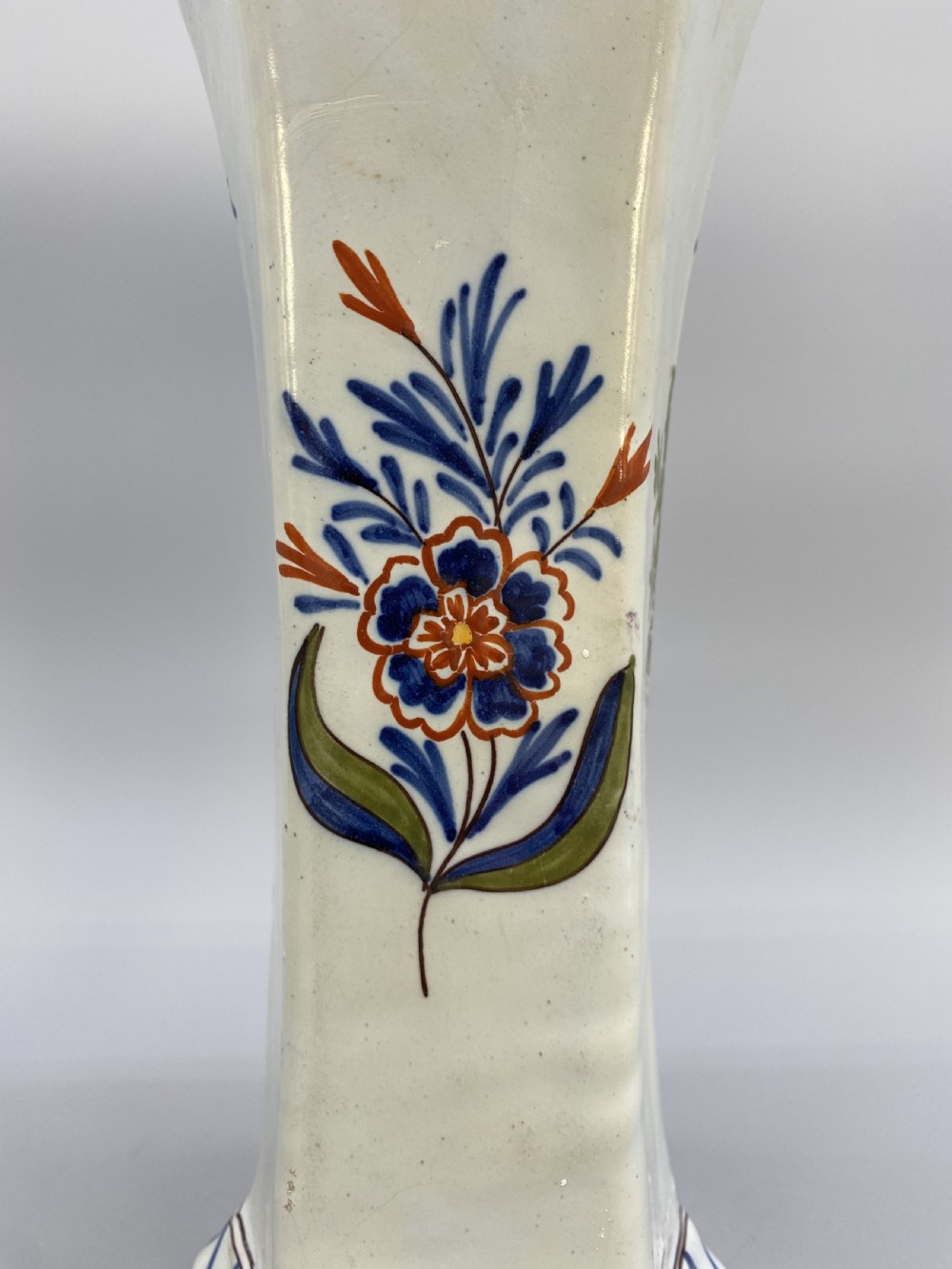 A pair of 18th-century octagonal flared Dutch Delft polychrome tin-glazed earthenware vases featuring hand-painted pastoral scenes of figures in landscape settings framed by floral motifs. View XIX