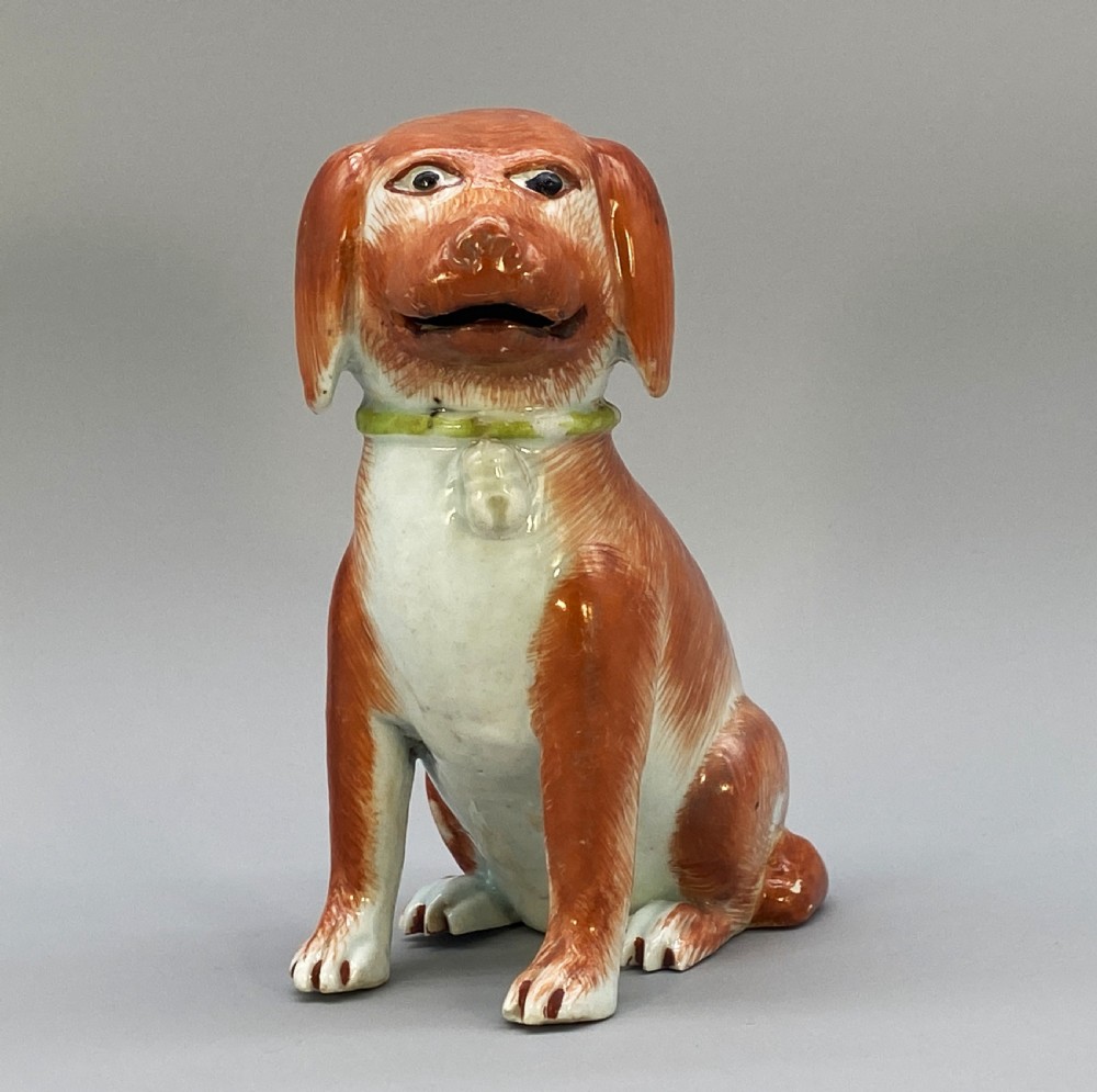 An 18th-century Chinese export porcelain figurine of a seated dog featuring iron-red fur painted details and a light green collar. View III