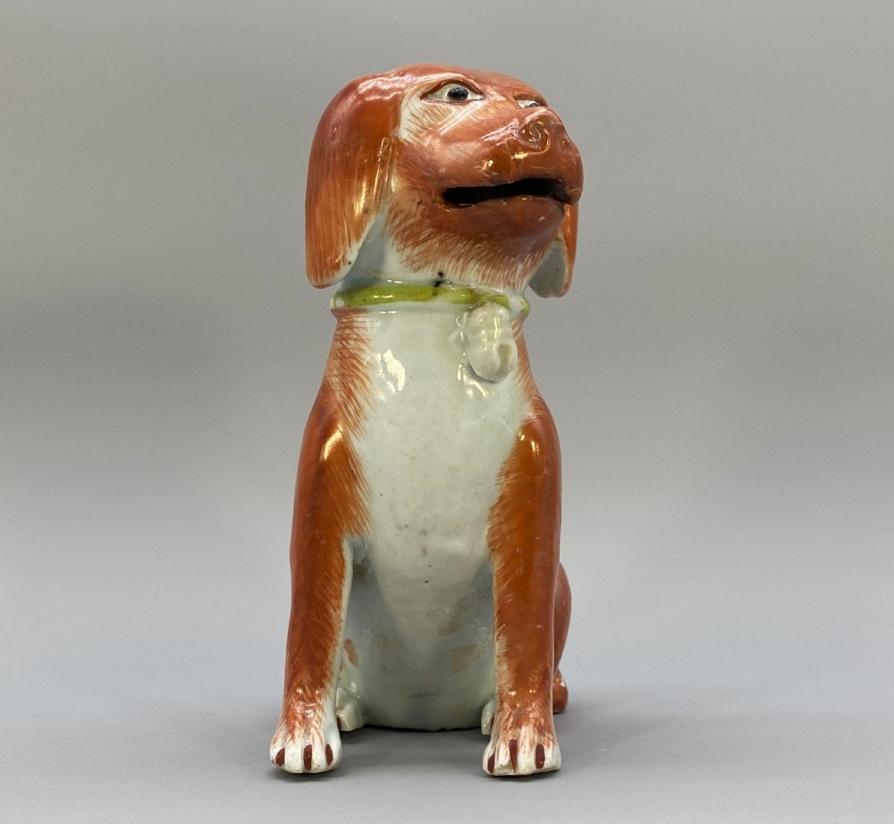 An 18th-century Chinese export porcelain figurine of a seated dog featuring iron-red fur painted details and a light green collar. View XIV