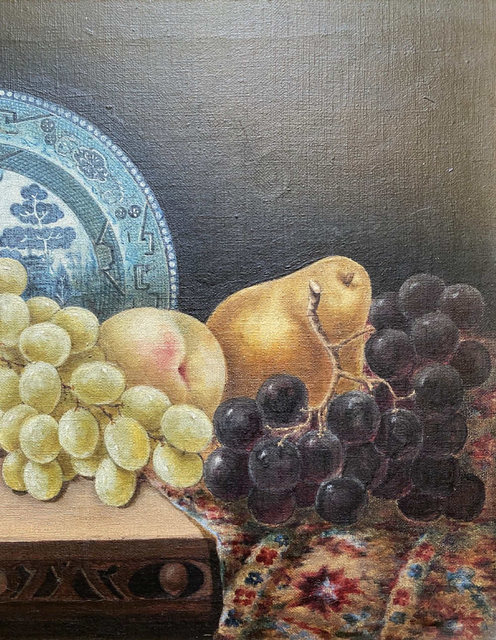 A late 19th-century still life oil painting on canvas depicting fruit and a blue patterned plate, framed in an ornate gilded frame. View V