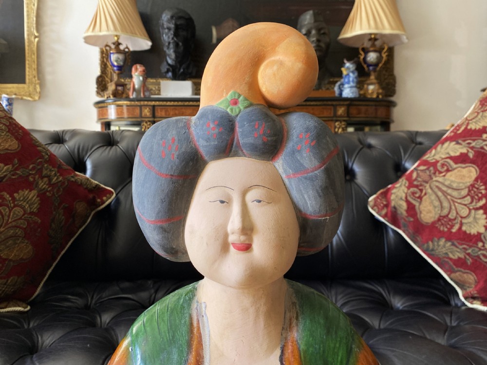A pair of large Sancai glazed ceramic sculptures depicting Tang Dynasty style female court musicians in orange, green, and cream robes. View VIII