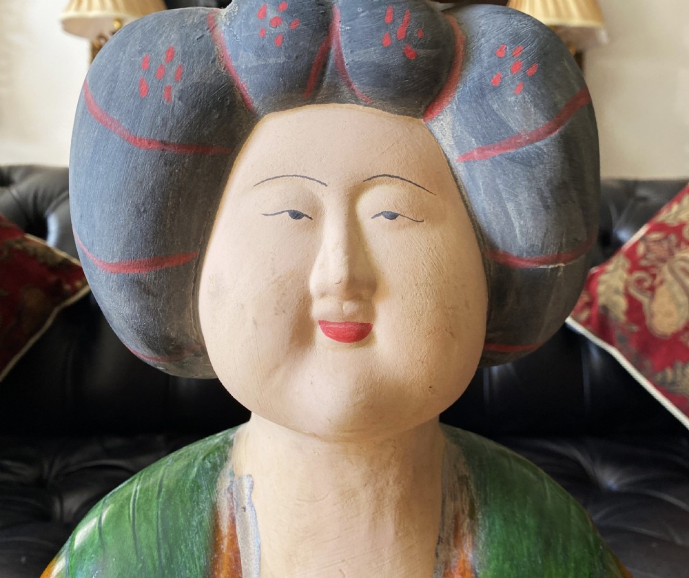 A pair of large Sancai glazed ceramic sculptures depicting Tang Dynasty style female court musicians in orange, green, and cream robes. View IX