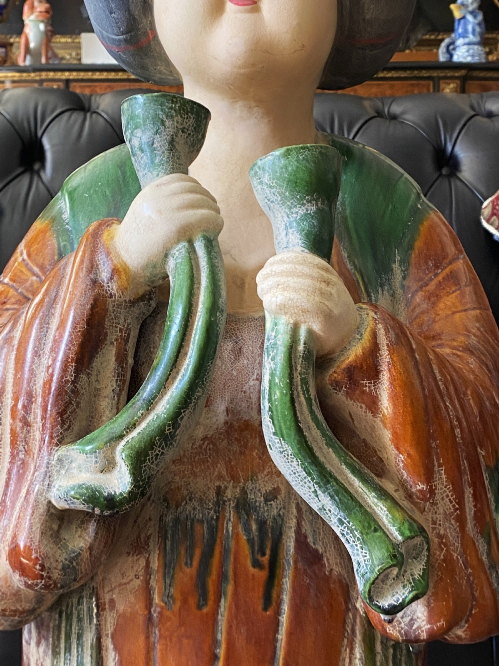 A pair of large Sancai glazed ceramic sculptures depicting Tang Dynasty style female court musicians in orange, green, and cream robes. View XIX